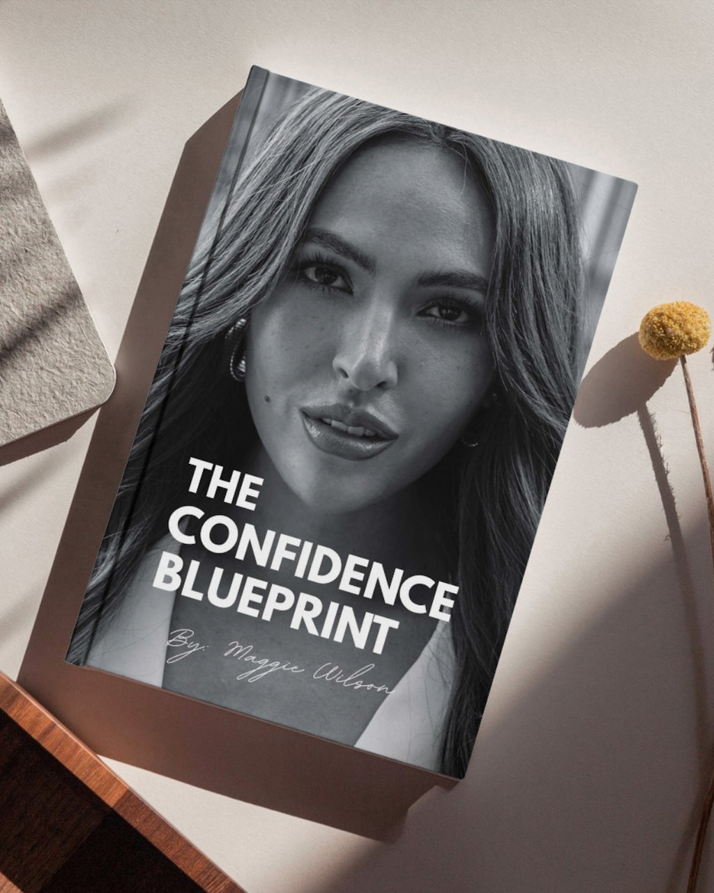 Paperback copy of The Confidence Blueprint by My Store, showing the book cover with title and author on a plain background.